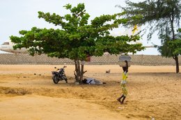 Abandoned-aircraft;-Airplane-wreck;-Barakah;-Beach;-Benin;-Cadjéhoun-Beach;-Carrying;-Chicken;-Cotonou;-Cotonou-airport;-Daily-life;-Kaleidos;-Kaleidos-images;-La-parole-à-limage;-Lockheed-L-1011;-Tarek-Charara;-TriStar;-Walking;-West-Africa;-Woman